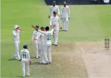  ?? | ©MUZI NTOMBELA BackpagePi­x ?? PROTEAS star Lungi Ngidi celebrates with teammates during the 2020 Betway Test Series against Sri Lanka at the Wanderers Stadium, Johannesbu­rg in a 2-0 series clean sweep for South Africa.