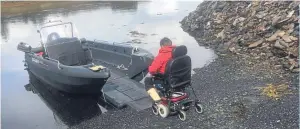  ??  ?? Graham MacQueen’s wife Morven boarding the specially-adapted boat