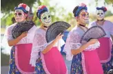 ?? MICHAEL CHOW/THE REPUBLIC ?? Dancers with Ballet Folklorico Quetzalli from Chandler prepare to perform at the sixth Annual Dia de Los Muertos PHX Festival at Steele Indian School Park in Phoenix on Sunday.