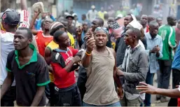  ?? — AP ?? Protesters of Kenya opposition leader Raila Odinga demonstrat­e in the Mathare area of Nairobi, Kenya, on Saturday.