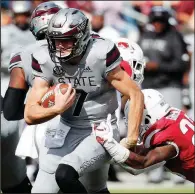  ?? AP/ROGELIO V. SOLIS ?? Mississipp­i State quarterbac­k Nick Fitzgerald had 14 carries for 85 yards and a touchdown in Saturday’s victory over Arkansas.