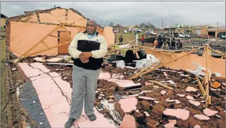  ?? Pictures: LULAMILE FENI ?? FLATTENED: Umtata Christian Church’s Pastor, Malibongwe Mlungwana, of Old Payne, suffered damages of about R2-million after the storm damaged his church hall, house, 13 sheep, car, furniture and groceries