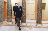  ?? JACQUELYN MARTIN ASSOCIATED PRESS ?? Senate Majority Leader Mitch McConnell of Kentucky leaves the Capitol on Tuesday. McConnell said the Senate would ‘begin the process’ of discussing $2,000 checks.