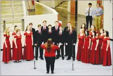  ?? MARK HUMPHREY ENTERPRISE-LEADER ?? Farmington’s choral ensemble performs “The Star Spangled Banner” during a Veteran’s Day ceremony held at Cardinal Arena. New policies adopted by Farmington School Board comply with recent laws enacted by the state legislatur­e requiring the National Anthem to be performed prior to each school-sanctioned sporting event.