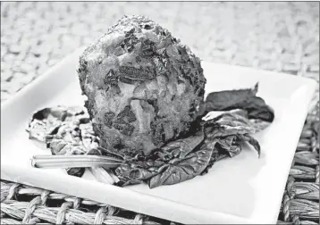  ?? HILLARY LEVIN/ST. LOUIS POST-DISPATCH PHOTOS ?? For the Lion’s Head Chinese meatballs, the grated rind of an orange adds a citrus kick and a mysterious allure.