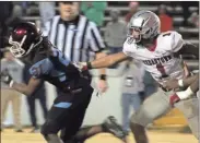  ?? Jeremy stewart ?? Cedartown’s Demarieo Sims (1) just misses grabbing Carver running back Jaiden Credle during Friday’s game in Columbus.