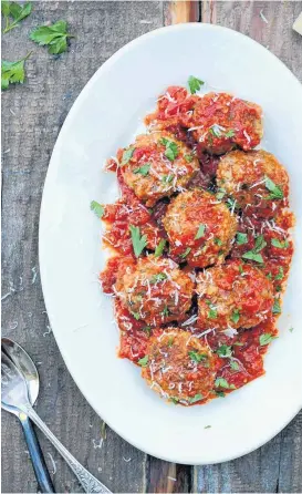  ??  ?? Smothered Italian meatballs in marinara sauce.