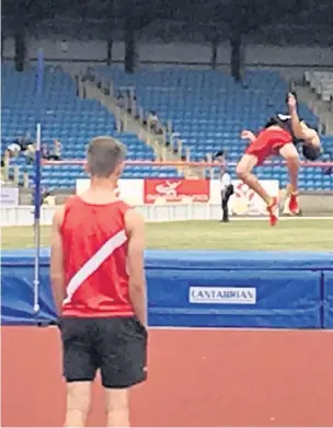  ??  ?? Jacob Thompson taking bronze at Birmingham with a jump of 1.84m