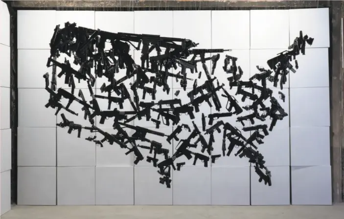  ?? Courtesy Michael Murphy ?? “Identity Crisis,” an installati­on of toy guns by artist Michael Murphy.