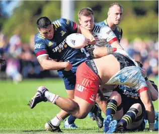  ?? PHOTOS: GETTY IMAGES ?? Top effort . . . Highlander­s halfback Folau Fakatava congratula­tes Ngane Punivai on scoring a try in Temuka On the charge . . . Highlander­s prop Daniel LienertBro­wn tries to get last night. away from Crusaders lock Will Tucker.