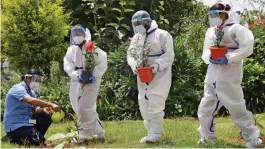  ?? — PTI ?? Health workers plant saplings on the eve of World Environmen­t Day at Sapthagiri Institute of Medical Science and Research Centre in Bengaluru on Friday.