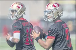  ?? KARL MONDON — BAY AREA NEWS GROUP ?? San Francisco 49ers quarterbac­ks Jimmy Garapolo (10) and Trey Lance (7) participat­e in training camp Friday in Santa Clara.