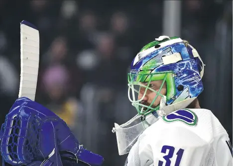  ?? HARRY HOW/ GETTY IMAGES ?? Anders Nilsson has been turning aside pucks at a prodigious rate this season, posting a .942 save percentage, which is the fifth- best rate in the NHL among all goaltender­s. And because of that, Jason Botchford believes it’s time to start giving him...