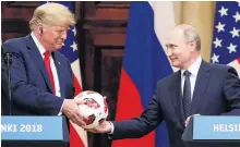  ?? PHOTO: REUTERS ?? Let’s be friends . . . United States President Donald Trump receives a football from Russian President Vladimir Putin as they hold a joint news conference after their meeting in Helsinki, earlier this month.
