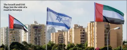  ?? PHOTO: FLASH90 ?? The Israeli and UAE flags ]on the side of a road in Netanya