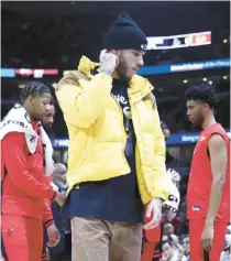  ?? TERRENCE ANTONIO JAMES/CHICAGO TRIBUNE ?? Bulls guard Lonzo Ball in street clothes during a game against the Hawks on Jan. 23 at the United Center.