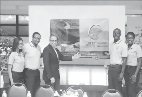  ??  ?? From left are Conference Sponsorshi­p Liaison Officer Mariesa Jagnanan, Conference Chair Cecil Maxwell, District Governor Waddy Sowma, District Rotaract Representa­tive– Elect Delon Earle and Public Relations Officer Julene Barrett, unveiling the logo...