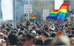  ??  ?? PEOPLE TAKE part in a gay pride parade in Tel Aviv last year.