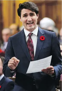 ?? THE CANADIAN PRESS ?? Prime Minister Justin Trudeau says Canada still wants tariffs lifted before the new NAFTA goes into effect and will work with whomever Americans elect in the key midterm elections.
