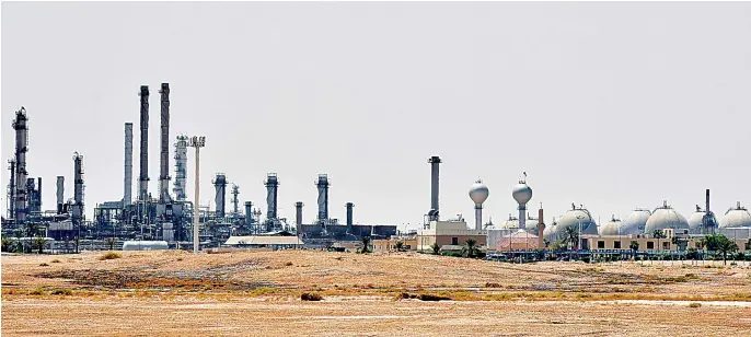  ?? AFP ?? A Saudi Aramco production facility outside Riyadh. The Kingdom’s oil giant will play a central role in meeting global demand for up to 100 million barrels of crude per day in coming years, a commitment that requires huge levels of investment.