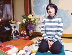  ?? PIC REUTERS ?? Taeko Watanabe, whose son Yuki committed suicide in 2008, is talking in front of his portrait at her home in Akita, Japan.