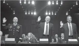  ??  ?? From left, National Security Agency Director General Keith Alexander, Director of National Intelligen­ce James Clapper, and Deputy Attorney General James Cole are sworn in on Capitol Hill Thursday in Washington.