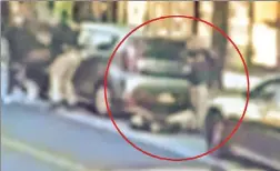  ?? ?? CHILLING: Surveillan­ce video from Wednesday in Queens shows fatally shot cop Jonathan Diller on the street after dragging himself behind the parked car from which bullets are believed to have rung out.