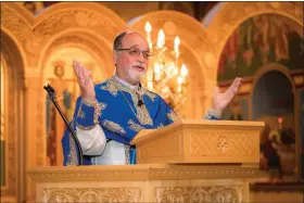  ?? SUBMITTED PHOTO BY CHRIS DIKOS ?? Rev. Father Thomas L. Pappalas delivers his final sermon as pastor of Sts. Constantin­e & Helen Greek Orthodox Church before his retirement.