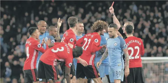  ??  ?? Fellaini is sent off after clashing with Aguero