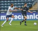  ?? SUBMITTED PHOTO - COURTESY OF PHILADELPH­IA UNION ?? Union midfielder Leon Flach, right, carries the ball into the box during a friendly against D.C. United at Subaru Park Wednesday. Flach signed with the Union from German club St. Pauli earlier in the day.