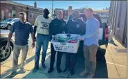  ?? SUBMITTED PHOTO ?? Norristown council president Thomas LePera and members of the IBEW Local 98 give out Thanksgivi­ng meals at Fairmount fire company.