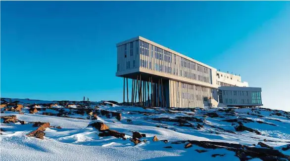 ??  ?? FOGO ISLAND INN IN NEWFOUNDLA­NDWAS MODELED AFTER THE THE ISLAND’S FISHING STAGES, SMALL BUILDINGS THAT REST ON STILTS.