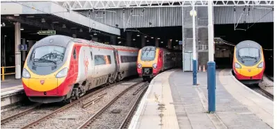  ?? JACK BOSKETT/ RAIL. ?? On February 28, a Virgin Trains Voyager is sandwiched by two VT Pendolinos at London Euston. The station is to be redevelope­d starting this year, in a project that will last 17 years.