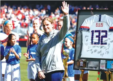  ??  ?? United States head coach Jill Ellis waves to the crowd as she is honoured during a ceremony before an internatio­nal friendly soccer match against South Korea Photo: AP