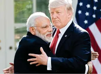  ??  ?? The embrace between Prime Minister Narendra Modi and US President Donald Trump at the White House