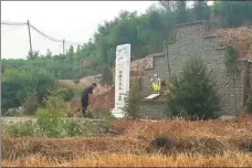  ?? PHOTOS BY SUN RUISHENG / CHINA DAILY AND PROVIDED TO CHINA DAILY ?? in Shanxi province builds a tomb to mark the 110th birth anniversar­y of Dutch priest Aemilianus van Heel, who spent years in the village in the 1930s and gave his life to protect the residents against Japanese aggressors.