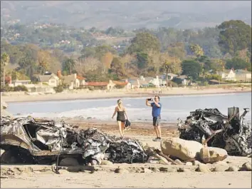  ?? Al Seib Los Angeles Times ?? TWO VEHICLES lie wrecked on the beach in Montecito, Calif., left there by massive mudslides this month.