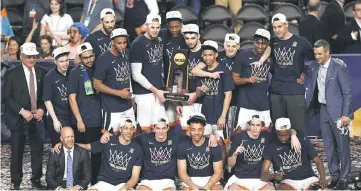  ??  ?? The Virginia Cavaliers celebrate with the trophy after their 85-77 win over the Texas Tech Red Raiders during the 2019 NCAA men’s Final Four National Championsh­ip game at US Bank Stadium in Minneapoli­s, Minnesota. — AFP photo