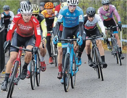  ?? CLIFFORD SKARSTEDT EXAMINER ?? Eventual winner Michael van den Ham, left, from Chilliwack, B.C., races in the 2019 Shimano Canadian Cyclocross Championsh­ips on Saturday at Nicholls Oval. Van den Ham will represent Canada for the next year at internatio­nal competitio­ns.