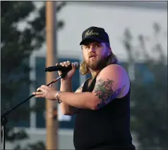  ?? (ZUMA Press Wire/Jeff Moore) ?? The country singer-songwriter known simply as Ernest brings some country to the Patriotic Festival in Norfolk, Va. The artist has written dozens of hits and has a new album of his own.
