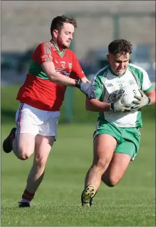 ??  ?? Jason Steed of Shamrocks is tackled by Rathnew’s Rory Dowing in Baltinglas­s last Sunday.