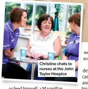  ??  ?? Christine chats to nurses at the John Taylor Hospice