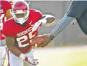  ??  ?? University of Oklahoma’s Joe Mixon works out during team practice at OU.
