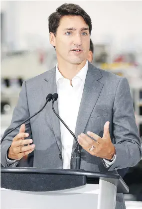  ?? JOHN WOODS / THE CANADIAN PRESS ?? Prime Minister Justin Trudeau, seen at a new Canada Goose factory in Winnipeg, said Tuesday he “won’t be weighing in” on Doug Ford’s efforts to downsize Toronto council.