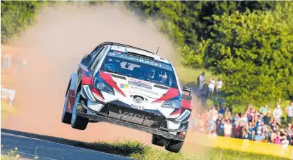  ?? Photos / Toyota Gazoo Racing WRC ?? ABOVE: Ott Tanak in high-flying form at WRC Rally Germany. BELOW: Ott Tanak (right) and co-driver Martin Jarveoja celebrate their WRC Rally Germany victory.