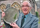  ??  ?? Iain Macleod from Edinburgh with the Dr Alasdair Patrick Barden Memorial Salver after winning the precenting psalm in a traditiona­l manner competitio­n. 21_MOD43nf293_precent