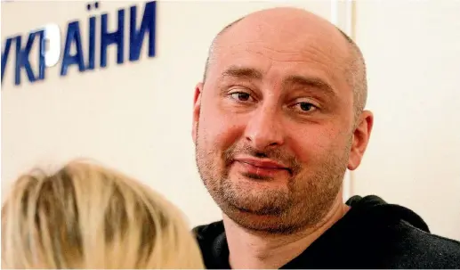  ?? AP ?? Russian journalist Arkady Babchenko stunned guests at a news conference held by the Ukrainian Security Service. He was joined by Vasily Gritsak, head of the Ukrainian Security Service, and Ukrainian Prosecutor-General Yuriy Lutsenko to explain his fake...