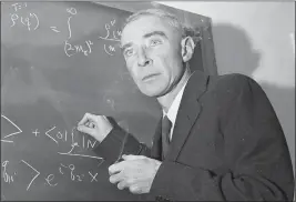  ?? JOHN ROONEY — THE ASSOCIATED PRESS FILE ?? Dr. J. Robert Oppenheime­r is shown at his study in Princeton University’s Institute for Advanced Study, Princeton, N.J., on Dec. 15, 1957.