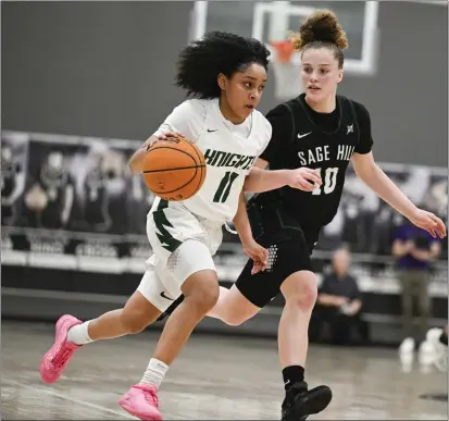  ?? ANJALI SHARIF-PAUL — STAFF PHOTOGRAPH­ER ?? Ontario Christian’s Kaleena Smith, left, drives the ball down the court against Sage Hill’s Amalia Holguin during Wednesday’s regional win.