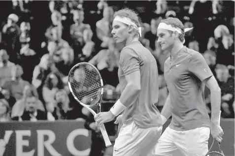  ?? AGENCE FRANCE PRESSE ?? Switzerlan­d's Roger Federer (R) and Spain's Rafael Nadal of Team Europe are seen during their double tennis match against Team World's Sam Querrey and Jack Sock during the second day of the Laver Cup on September 23, 2017 in O2 Arena, in Prague.